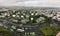 Beautiful wide-angle aerial view of Reykjavik, Iceland, with scenery beyond the city, seen from the observation tower of