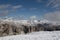 Beautiful wide Landscape of the Dolomites, view from Sass Pordoi in spring where the mountains are still covered in Snow