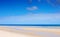 Beautiful wide open beach with blue skies in Summer