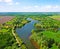 A beautiful wide river in the middle of lush greenery in spring in Ukraine