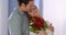 Beautiful wife gets surprised with bouqet of roses