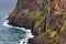 Beautiful wild coast scenery view with Bridal Veil Falls Veu da noiva at Ponta do Poiso in Madeira Island. Near Porto Moniz,
