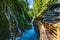 Beautiful Wimbachklamm gorge with wooden path in autumn colors, Ramsau bei Berchtesgaden in Germany. Waterfall at Wimbachklamm