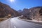 Beautiful winding road through mountains in sunny summer day