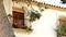 Beautiful window with red flowers. Spain, Altea