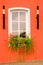 Beautiful window on red wall