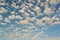 Beautiful windy clouds on a blue sky in a summer sunny day.