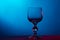 Beautiful wine glass on blue background