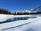 Beautiful winter atmosphere on storage lake Valos or reservoir lake Valos (Speichersee Valos)