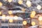 Beautiful winter blurred background of Tbilisi city with falling snow and bokeh lights