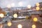 Beautiful winter blurred background of Tbilisi city with falling snow and bokeh lights