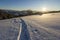 Beautiful winter Christmas landscape. Human footprint track path