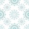 Beautiful winter design with teal and silver stylised snowflakes. Seamless vector pattern on white background. For