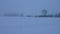 Beautiful winter landscape. Agricultural field covered by snow. Falling snow. Panning.