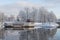Beautiful winter landscape with cafeteria in shape of boat with nice reflection in water