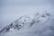 Beautiful Winter landscape image of snowcapped peak of Stob Dearg Buachaille Etive Mor in Glencoe, Rannoch Moor