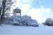 Beautiful winter landscape with snowy trees in a park with Monopter, Greek-style rotunda in the background in Munich