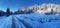 Beautiful winter landscape. Winter road in the mountains between snowy green firs