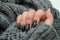 Beautiful winter manicure. Black lacquer with luster and white patterns of snow and frost. The gray background is also