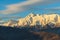 Beautiful winter mountain landscape of Main Caucasus ridge with scenic snowy Chugush mountain peak and blue sky at sunset