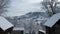 Beautiful winter in a mountain village. A view of the houses among the mountains in winter