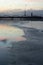 A beautiful winter sunrise landscape in Latvia capital Riga with frozen river Daugava.