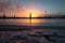 A beautiful winter sunrise landscape in Latvia capital Riga with frozen river Daugava.