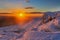 Beautiful winter sunrise over a snow covered mountain in the Brecon Beacons