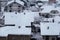 Beautiful winter view of houses and buildings with roofs covered with heavy snow. In snowy season, roof with lot snow.