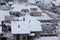 Beautiful winter view of houses and buildings with roofs covered with heavy snow. In snowy season, roof with lot snow.