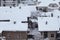 Beautiful winter view of houses and buildings with roofs covered with heavy snow. In snowy season, roof with lot snow.