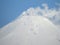 Beautiful winter volcanic landscape of Kamchatka Peninsula: view of eruption active Klyuchevskoy Volcano at sunrise. Eurasia,