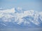 Beautiful winter volcanic landscape of Kamchatka Peninsula: view of eruption active Klyuchevskoy Volcano at sunrise. Eurasia,