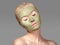 Beautiful Woman Applying Green Facial Mask. Beauty Treatments. Close-up Portrait of Spa Girl Apply Clay Facial mask