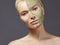 Beautiful Woman Applying Green Facial Mask. Beauty Treatments. Close-up Portrait of Spa Girl Apply Clay Facial mask