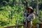 Beautiful woman with asian hat on rice terrace in Bali & x28;Indonesia