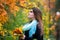 Beautiful woman in autumn, cute plus size model outdoors