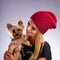 Beautiful woman with autumn fashion - Embracing yorkshire terrier dog