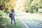 Beautiful woman backpack relaxing on the road. Vacation time and summer