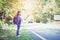 Beautiful woman backpack relaxing on the road. Vacation time and summer