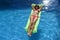 beautiful woman in bikini lying relax on float airbed at vacacti