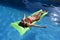 beautiful woman in bikini lying relax on float airbed at vacacti