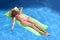 Beautiful woman in bikini and sun hat on face lying relax on fl