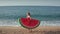 Beautiful woman in bikini walking on sandy beach
