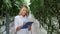 Beautiful woman biology agronomist checking fertilize condition organic cucumber growing greenhouse