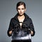 Beautiful woman in black  holds fashion handbag