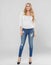 Beautiful woman blonde curly hair portrait jeans fashion