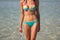 Beautiful woman body in bikini in sea water