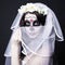 beautiful woman bride with creative sugar skull make up and bridal veil over black