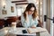 Beautiful woman in cafe reading interesting book